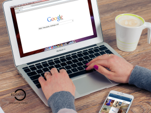 Business owner reading customer ratings and online reviews on a laptop.
