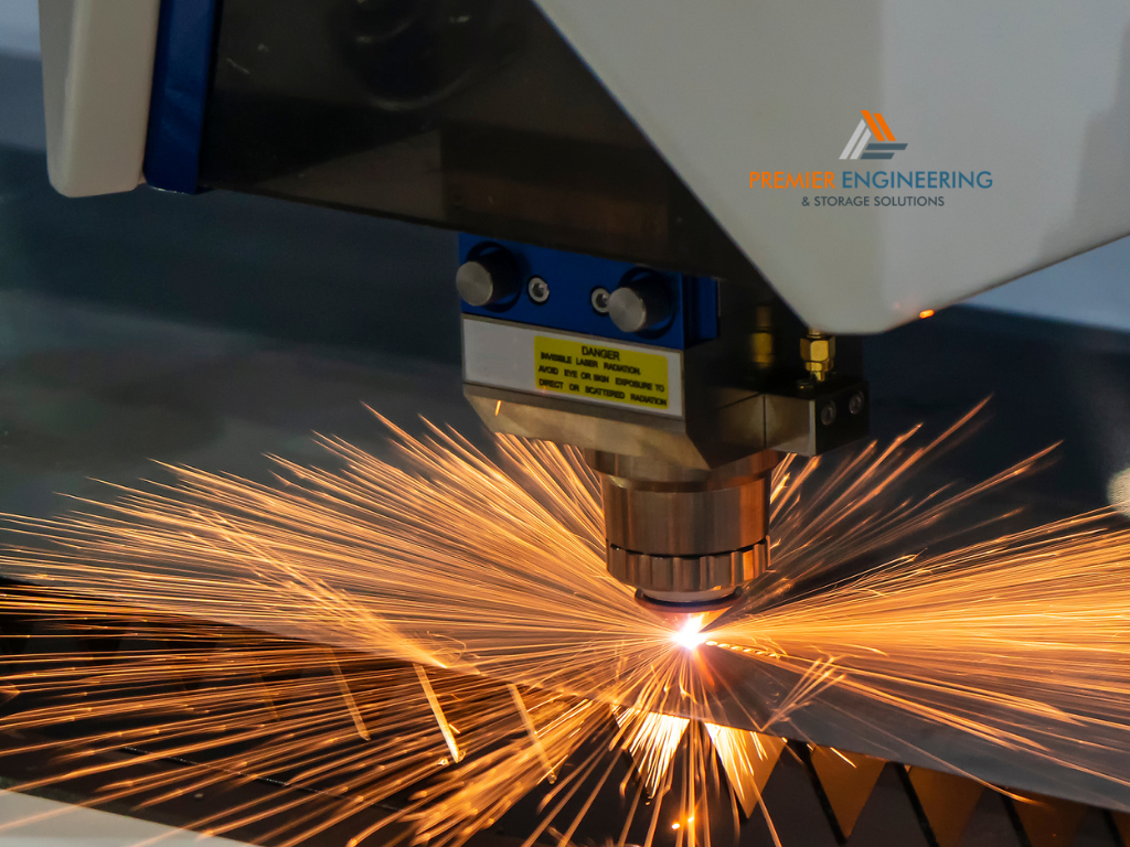 Laser-cut acrylic panels beside precision metal components showing different materials and edge finishes.