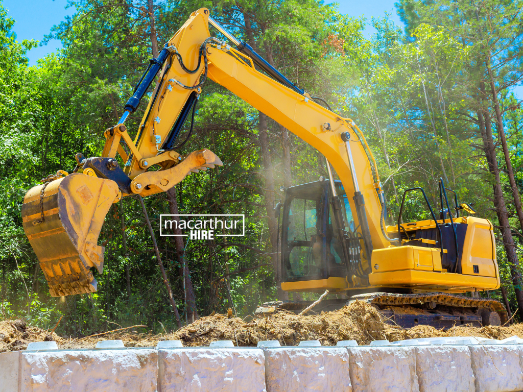 Compact excavator preparing soil for a residential backyard landscaping project. equipment hire camdenequipment rental camden, Equipment Hire Catherine Field, Equipment Hire Leppington, equipment hire narellan, equipment rental narellan, Excavator Hire Narellan, equipment rental glen alpine