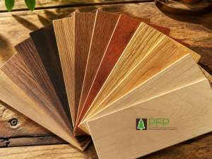 Multiple natural timber veneer sheets arranged together to compare colour variation and grain consistency between panels