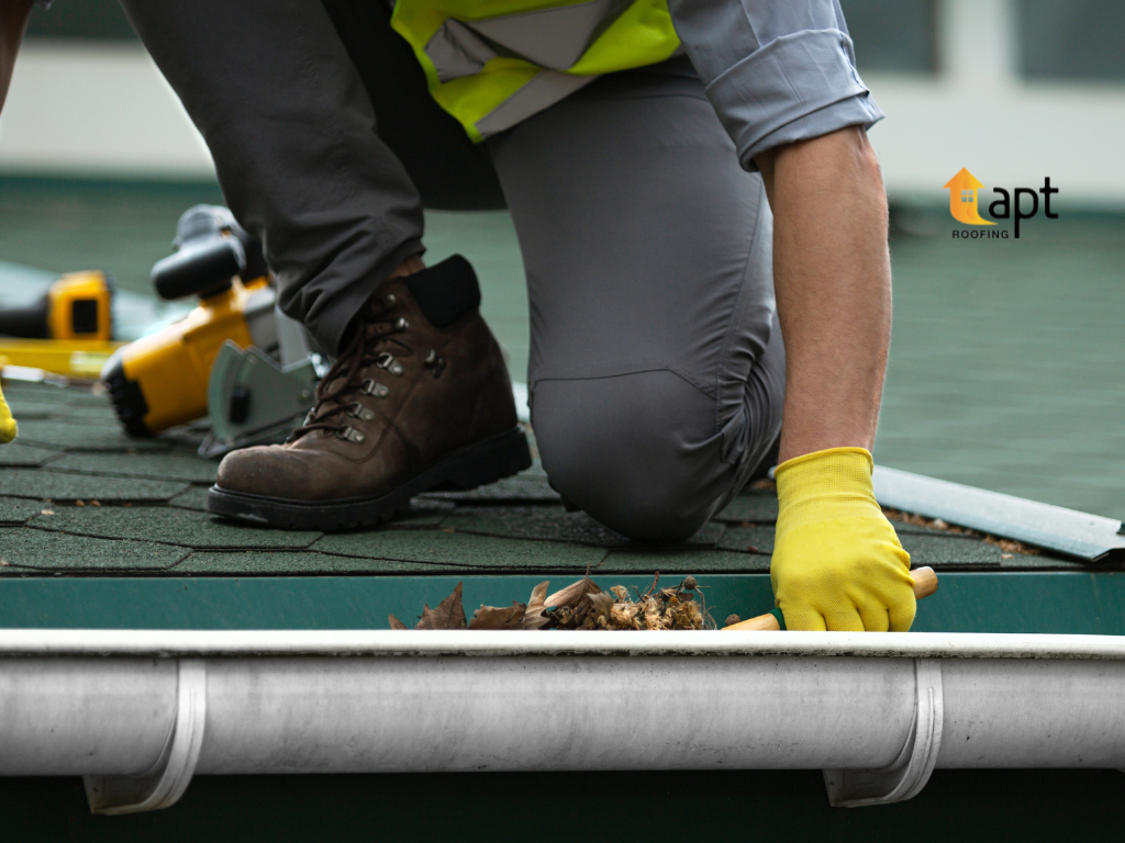 Roofer inspecting and cleaning residential roof gutters in the Macarthur Region. Roof Maintenance in Macarthur RegionRoof Repair in Macarthur Region, roof maintenance in macarthur, roof maintenance in smeaton grange, roof repair in smeaton grange, Roof Repair in Outer Western Suburbs, Roof Maintenance in Outer Western Suburbs, Roof Repair in Parramatta Hills District